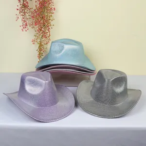 Close-up of shiny glitter cowboy hats with silver trim and metallic texture for party events