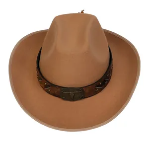 Detail of western cowboy hat featuring vintage leather band with metal bull head buckle