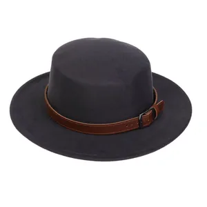 Detail of dark grey wool felt boater hat with a brown leather decorative buckle band