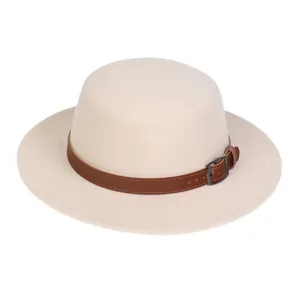 Detail of beige felt boater hat featuring a brown leather band and dark metal buckle