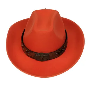 Macro shot of an orange felt cowboy hat featuring a leather strap with a metallic bull head buckle