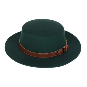 Detail of dark green flat top wool fedora hat featuring a brown leather band and buckle