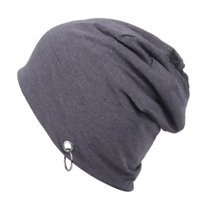 Dark grey knitted beanie with double silver metal rings and trendy slouchy street style