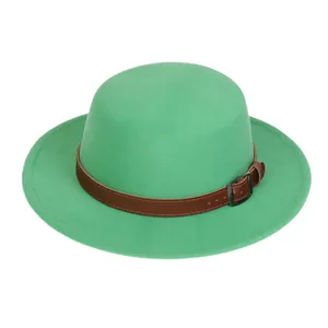 Detailed view of green wool felt fedora featuring a brown leather strap and metal buckle
