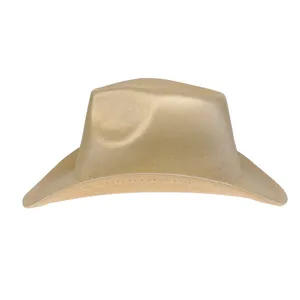 Detail of the golden cowboy hat showing its textured metallic surface and wide brim