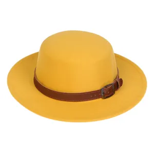 Detailed view of the yellow felt boater hat with its brown leather strap and metal buckle