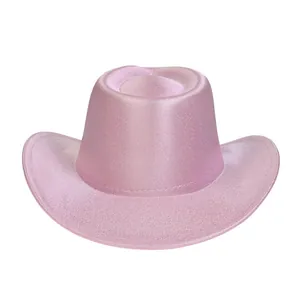 Detail of pink glitter texture on Western cowboy hat with curled brim for parties