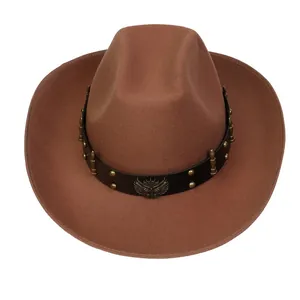 Detail of western cowboy hat featuring leather band with eagle emblem and metal studs