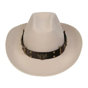 Detail of beige felt cowboy hat with brown leather band, gold rivets and wing emblem