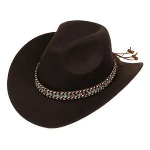 Detailed close-up of dark brown wool felt cowboy hat with ethnic beadwork and leather fringe
