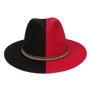 Detail of two-tone wool fedora with red and black stitching and rhinestone leather band