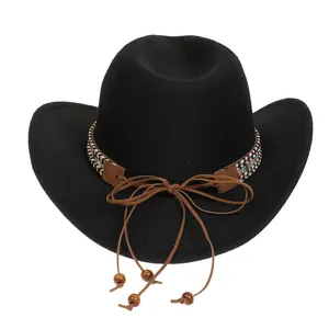 Detail of black felt cowboy hat with ethnic braided band and wooden bead chin strap