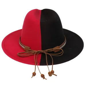 Detail of red and black bicolor fedora featuring a rhinestone band and wooden beads decor
