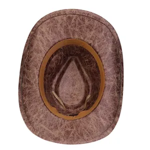 Detail of vintage faux leather cowboy hat with cracked texture and adjustable inner strap