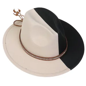 Detail of two-tone beige and black felt fedora with studded leather band and wooden beads