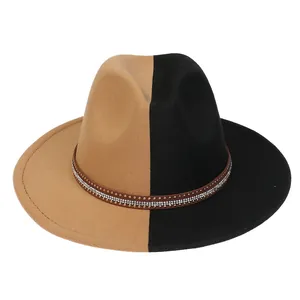 Detail of two-tone wool fedora featuring a decorative belt with rhinestones and gold studs