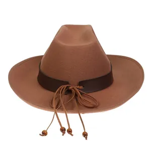 Detail of brown wool cowboy hat featuring a leather band with fringes and wooden beads