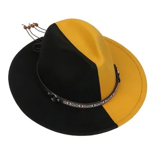 Détail d'un chapeau fedora en laine bicolore noir et jaune avec ruban ethnique chic