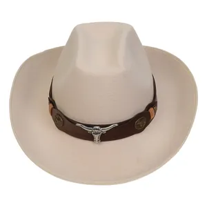 Detail of cream cowboy hat with a metal bull head ornament on a brown leather band