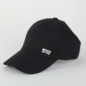 Detail shot of black sun hat featuring white DYJ embroidery and cotton twill texture