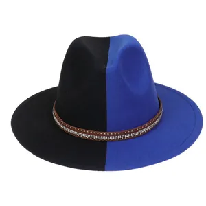 Detail of two-tone jazz hat with wide brim and rhinestone-studded brown ribbon band