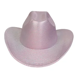 Macro detail of pink cowboy hat featuring silver glitter texture and stylish curved brim