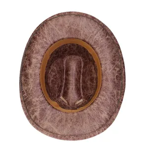 Top view of vintage brown cowboy hat interior featuring sweatband and stitching details