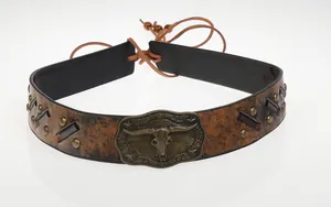 Detail of vintage brown leather cowboy hat band with a bull skull metal buckle and studs