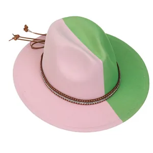 Detail of two-tone pink and green wool fedora with rhinestone leather band and tassels