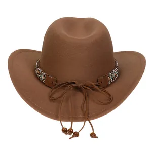 Detail of dark brown wool felt cowboy hat with ethnic braided band and beaded tassels