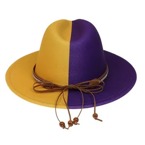 Detail of two-tone wool fedora featuring rhinestone leather band and wooden beads