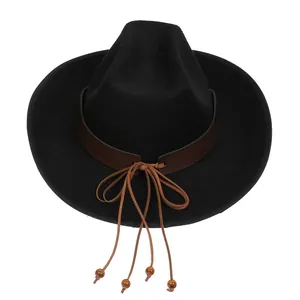 Detail of black cowboy hat featuring brown leather band and ethnic wooden beads