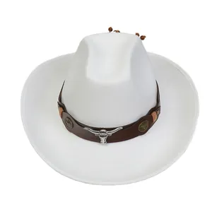 Detail of white felt cowboy hat with leather band and silver bull skull metal emblem