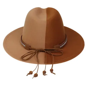 Detail view of two-tone wool fedora with studded leather band and wooden bead tassels