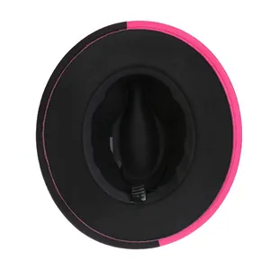 Détail intérieur du chapeau en laine montrant le bandeau noir et l'étiquette de coton