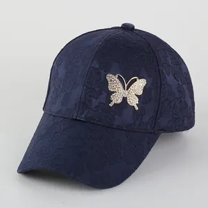 Navy blue baseball cap with jacquard texture and sparkling rhinestone butterfly emblem