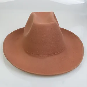 Detailed top view of a rust red wool felt cowboy hat with wide brim and shaped crown