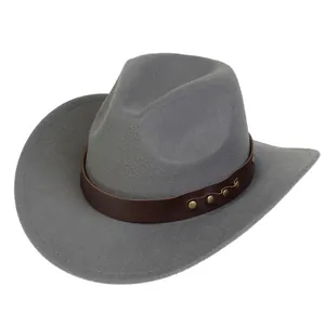 Close-up of grey felt cowboy hat featuring dark brown leather band and gold metal rivets