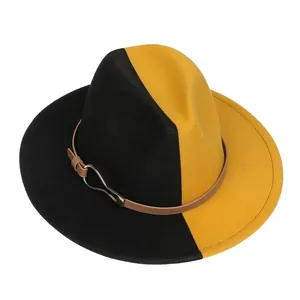Détail d'un chapeau fedora en laine bicolore avec surpiqûres et boucle en cuir