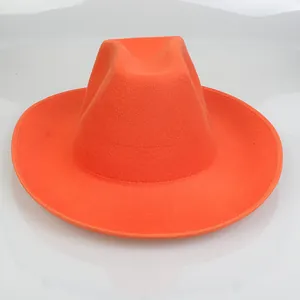 Top view of bright orange fedora hat with a wide brim and textured wool felt finish
