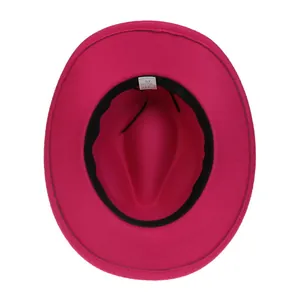 Detail view of pink felt fedora hat interior with adjustable strap and size label