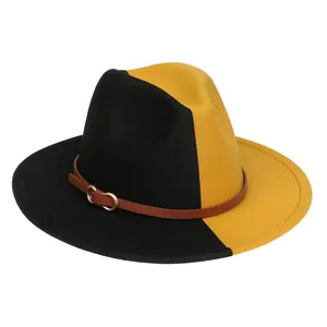 Détail du chapeau en laine bicolore noir et jaune avec une bande en cuir élégante