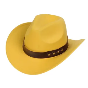 Detail of yellow wool cowboy hat featuring a leather band with gold rivets and curved brim