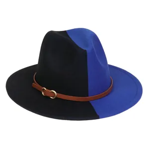 Détail du chapeau Fedora bicolore avec bandeau en cuir marron et boucle dorée