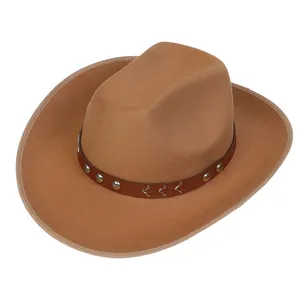 Detail of camel wool cowboy hat featuring a brown leather band and metallic V-shaped accents