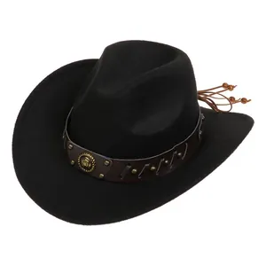 Detail of black cowboy hat with leather band, vintage metal studs and beaded tassels