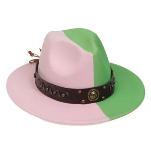 Detail of pink and green wool felt hat with brown leather band and horseshoe buckle