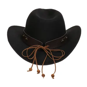 Detail of black cowboy hat with brown leather band, gold rivets, and decorative wood beads