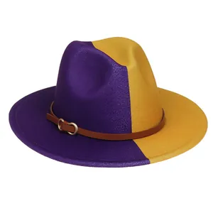 Détail d'un chapeau bicolore en laine feutrée violet et jaune avec sangle en cuir brun