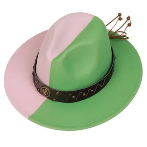 Detail of two-tone wool fedora with gold lion emblem and studded leather band